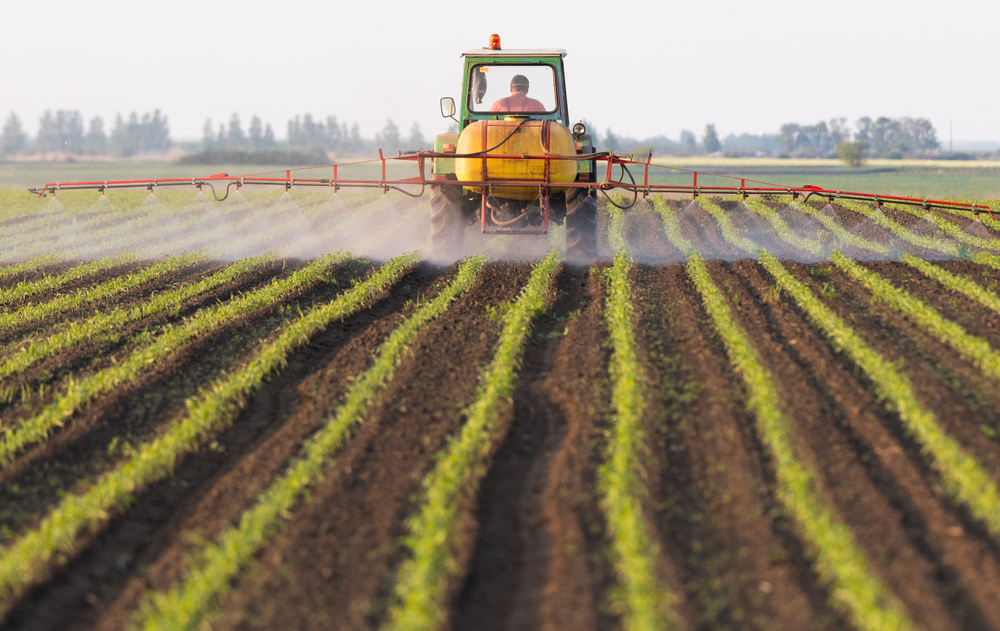 Tractor,Spraying,Pesticides,At,Corn,Fields