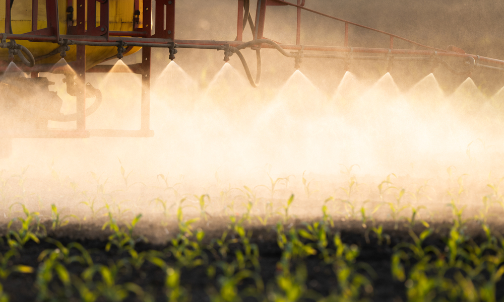 Tractor,Spraying,Pesticides,At,Corn,Fields