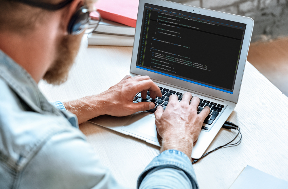 Over,Shoulder,Closeup,View,Man,It,Coder,Programmer,Software,Engineer