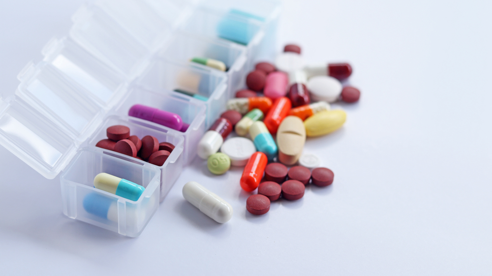 Pill,Box,Daily,Take,A,Medicine,,With,Colorful,Of,Pills,