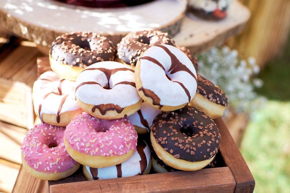 Mini,Donuts,In,A,Wooden,Box.,Donuts,In,Colored,Glaze.