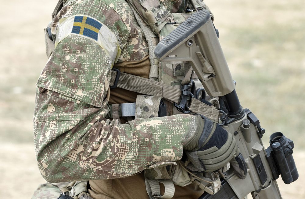 Soldier,With,Assault,Rifle,And,Flag,Of,Sweden,On,Military
