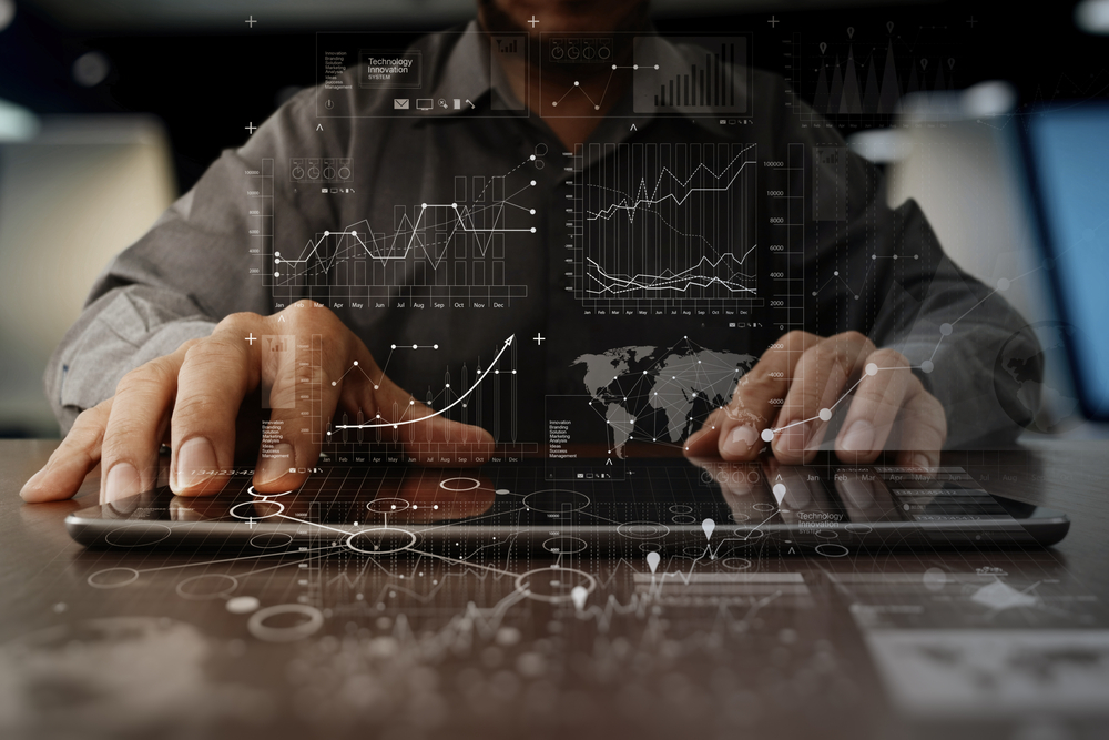 Businessman,Hand,Working,On,Laptop,Computer,With,Digital,Layer,Business