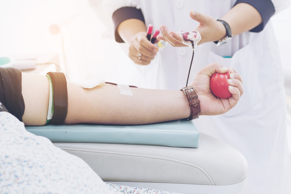 Blood,Donor,At,Donation,With,A,Bouncy,Ball,Holding,In