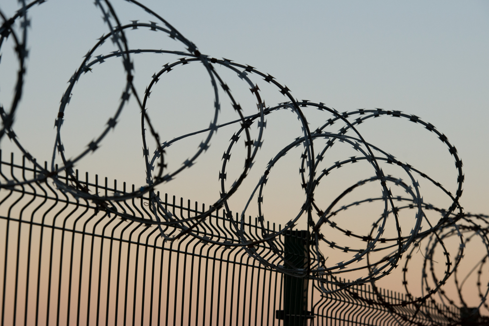 Fence,With,Barbed,Wire,Defending,Against,Refugees