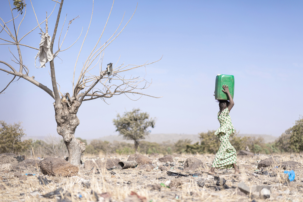 Tiny,African,Ethnicity,Women,Working,With,Fresh,Water,As,A