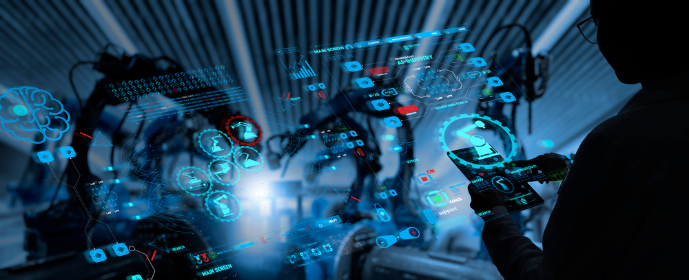 Factory,Female,Industrial,Engineer,Working,With,Automation,Robot,Arms,Machine