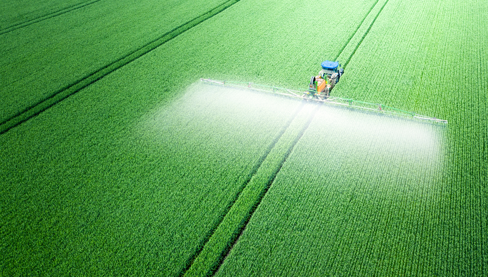 The,Tractor,Applies,Herbicides,,Pesticides,Or,Fertilizers,To,The,Green