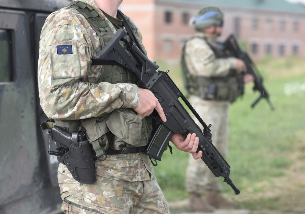 Soldiers,With,Assault,Rifle,And,Flag,Of,Kosovo,On,Military