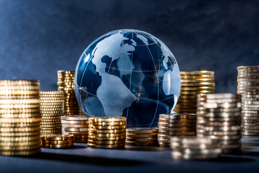 Globe,And,Stack,With,Coins.,Money,Makes,The,World,Go