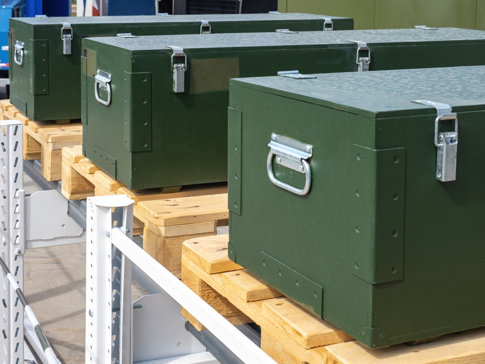 Close-up,Of,Boxes,With,Metal,Fasteners.,Green,Boxes,On,Wooden