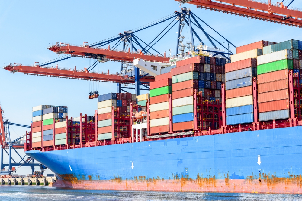 Freight,Ship,Being,Loaded,With,Containers,In,A,Port,On
