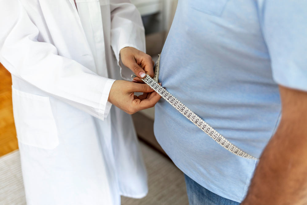 Women,Doctor,Measuring,Overweight,Man,In,Clinic.,Young,Female,Doctor