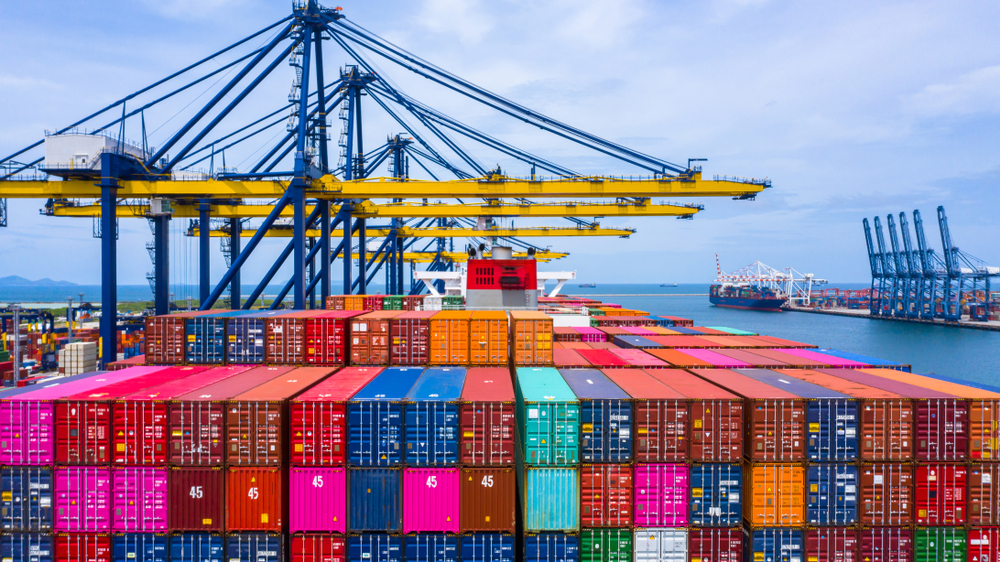 Container,Ship,Loading,And,Unloading,In,Sea,Port,,Aerial,View