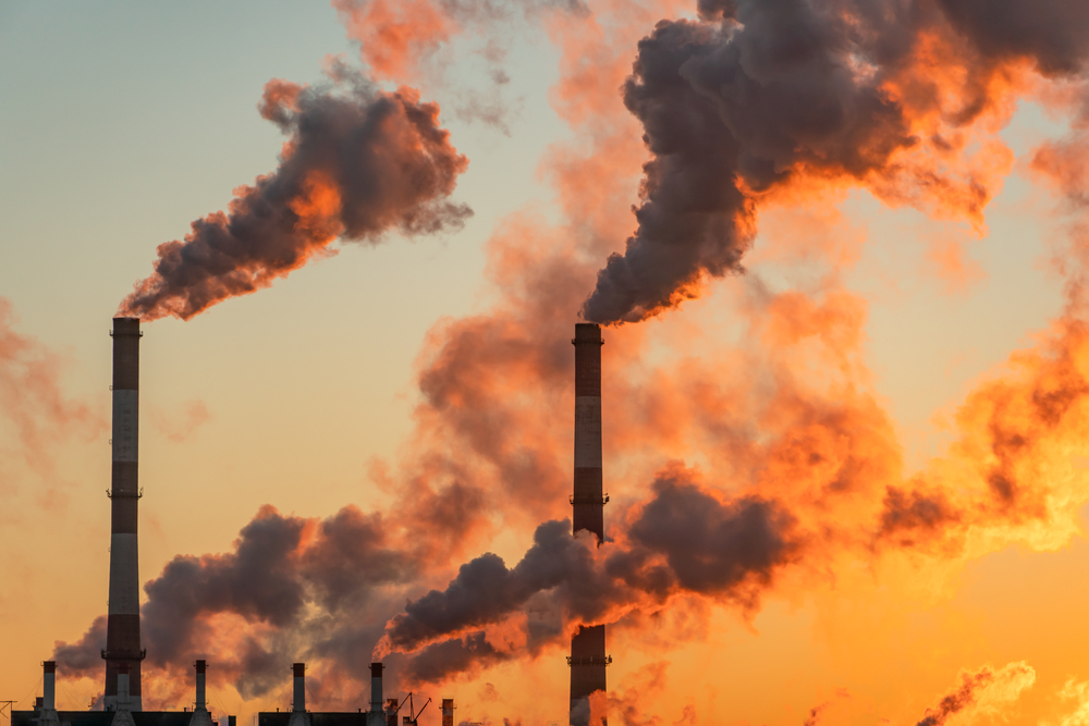 Aerial,View,Of,High,Smoke,Stack,With,Smoke,Emission.,Plant