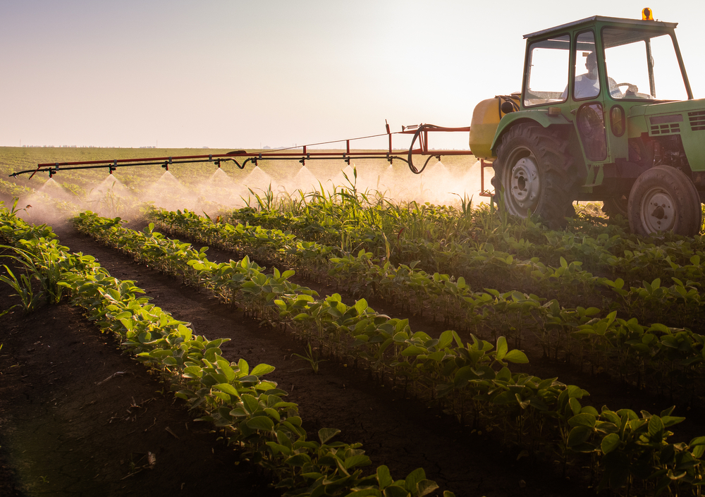 Tractor,Spraying,Pesticides,On,Soy,Field,With,Sprayer,At,Spring