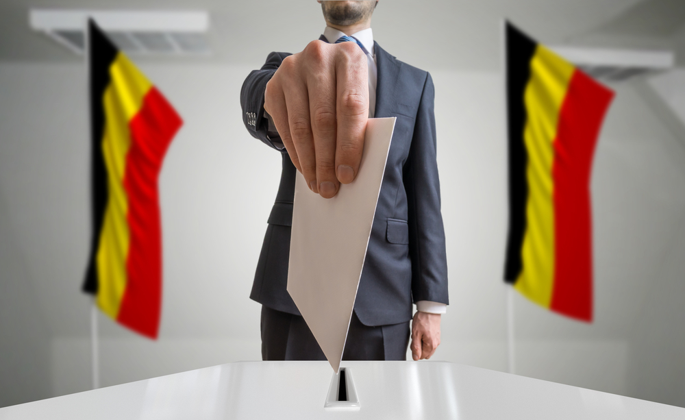 Election,Or,Referendum,In,Belgium.,Voter,Holds,Envelope,In,Hand