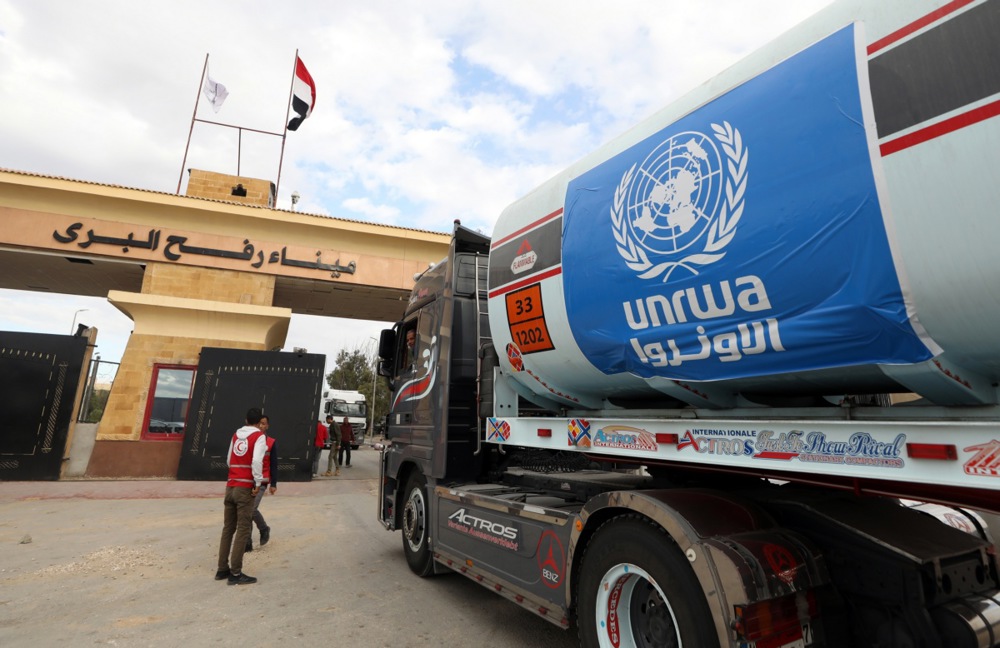 Rafah border crossing between Gaza and Egypt opens to allow humanitarian aid and limited evacuations