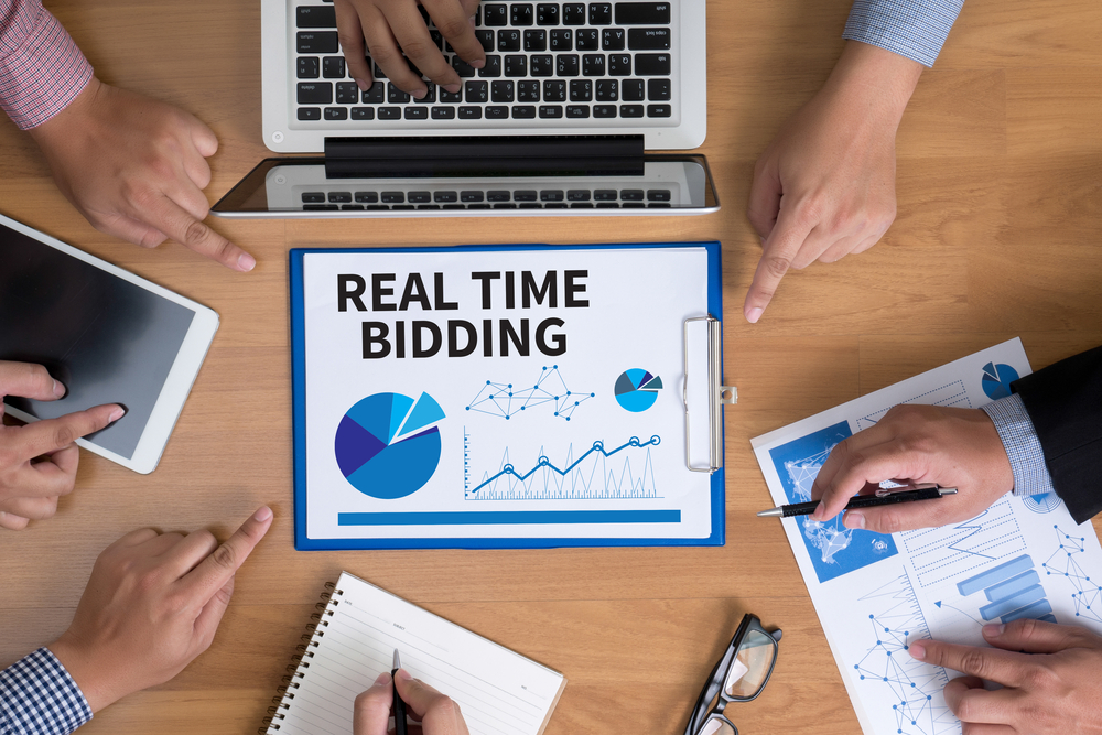 Real,Time,Bidding,Business,Team,Hands,At,Work,With,Financial
