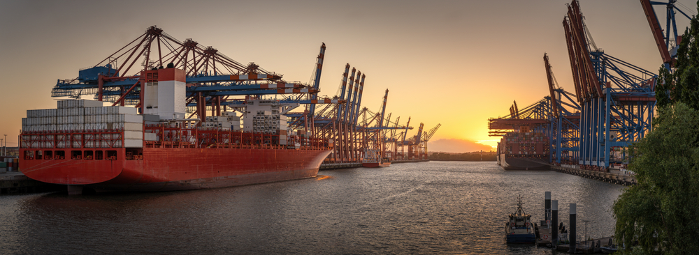 Container,Ships,In,The,Port,Of,Hamburg,At,Sunset