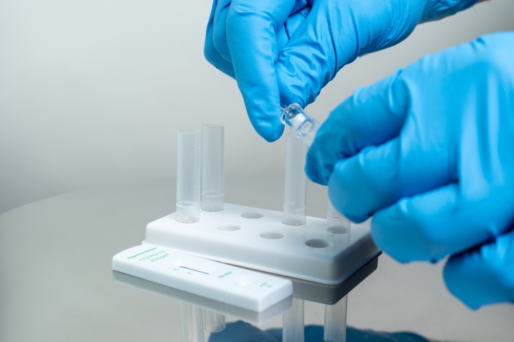 Person,In,Blue,Gloves,Performs,Covid-19,Rapid,Test,At,Home