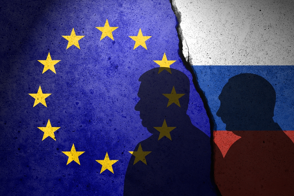 Eu,And,Russia,Flags,Painted,On,The,Concrete,Wall.,Viktor