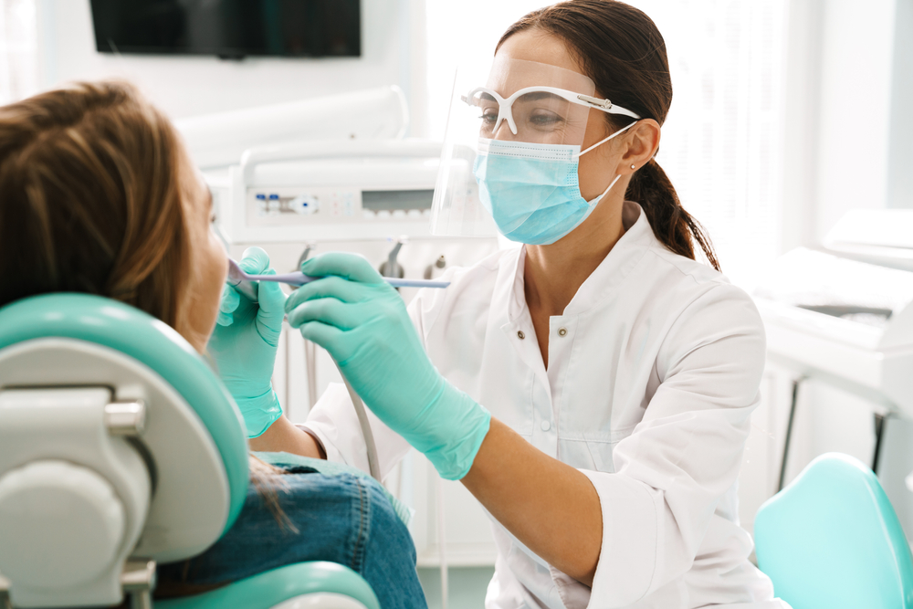 European,Mid,Pleased,Dentist,Woman,In,Face,Mask,Working,In