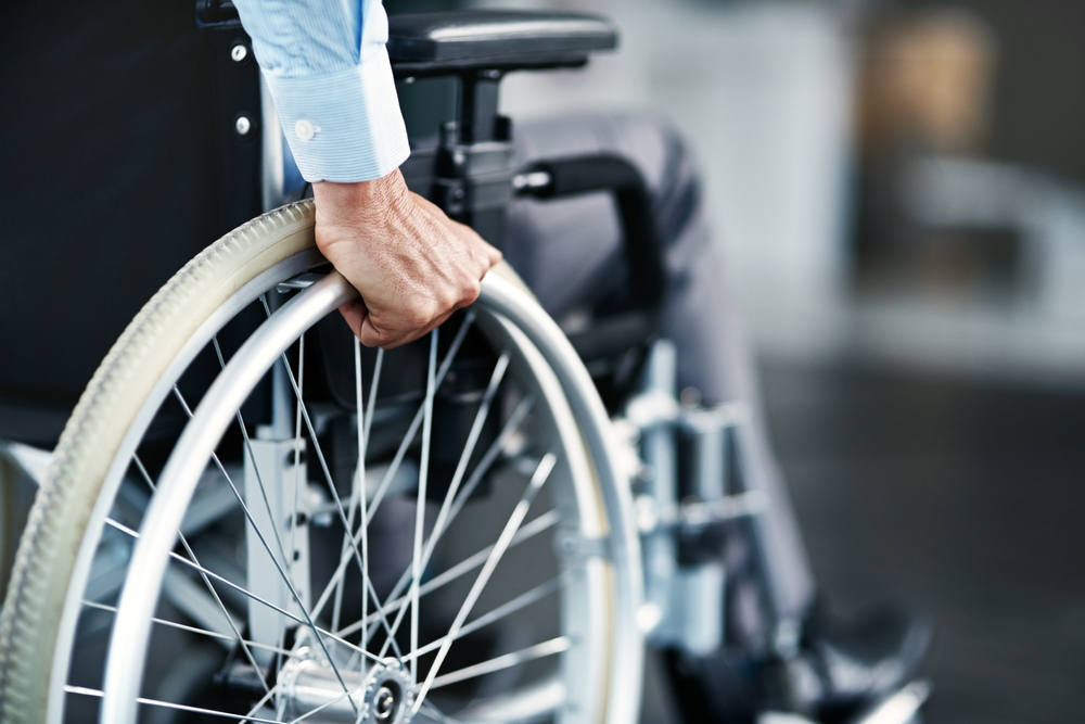 Wheelchair,,Disability,And,Man,Hand,Holding,Wheel,In,A,Hospital