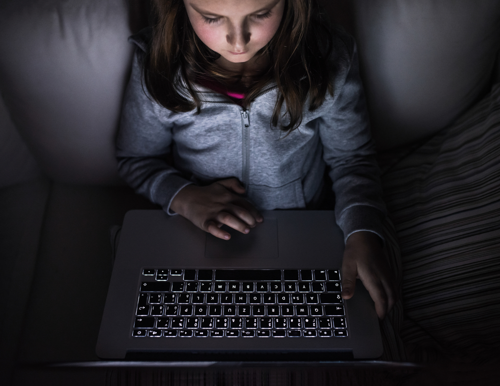 Little,Girl,,Sitting,In,A,Dark,,Playing,With,Laptop