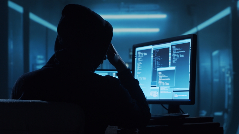 Computer,Hacker,In,Hoodie.,Obscured,Dark,Face.,Concept,Of,Hacker