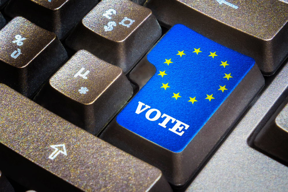 Vote,Push,Button,On,A,Black,Keyboard,With,European,Flag.