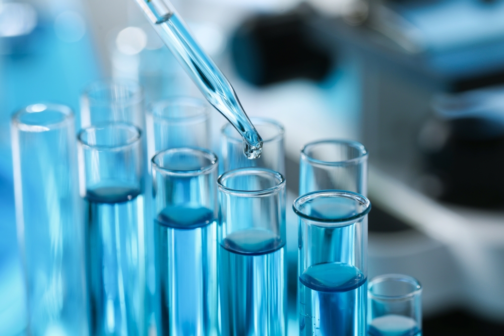 Dripping,Liquid,From,Pipette,Into,Test,Tube,In,Laboratory,,Closeup