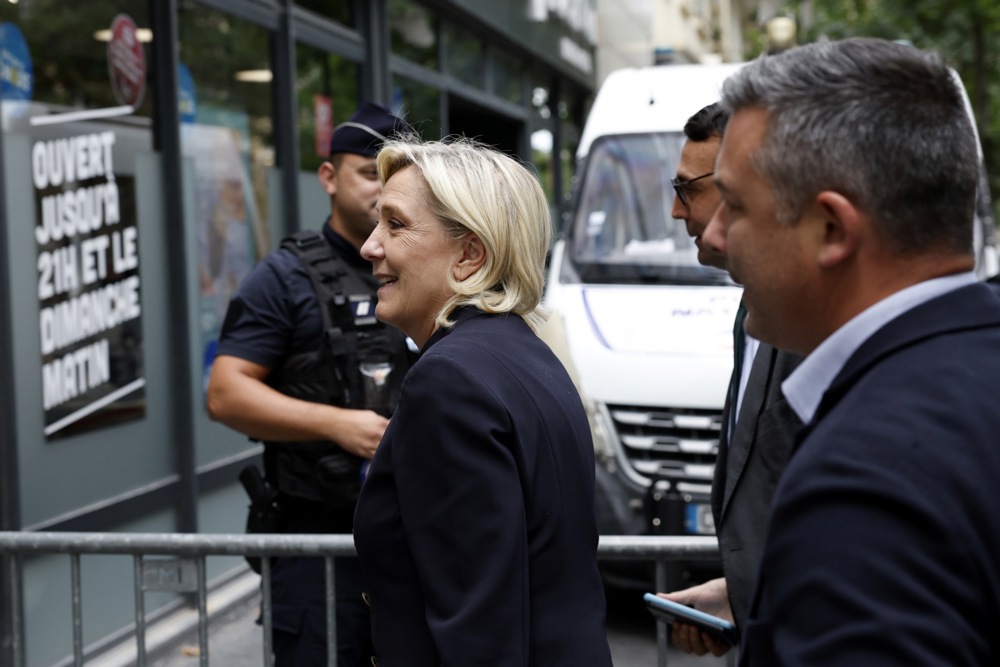 Marine Le Pen arrives at Rassemblement National (RN) party headquaters in Paris