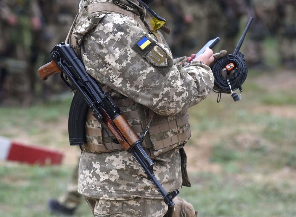 Soldier,Of,Ukraine,With,Assault,Rifle,Ak,Use,Smartphone.,Ukrainian