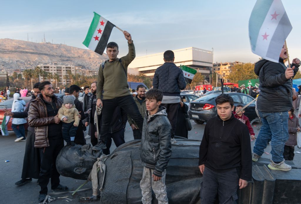 Syrians topple statues of Hafez al-Assad across the country
