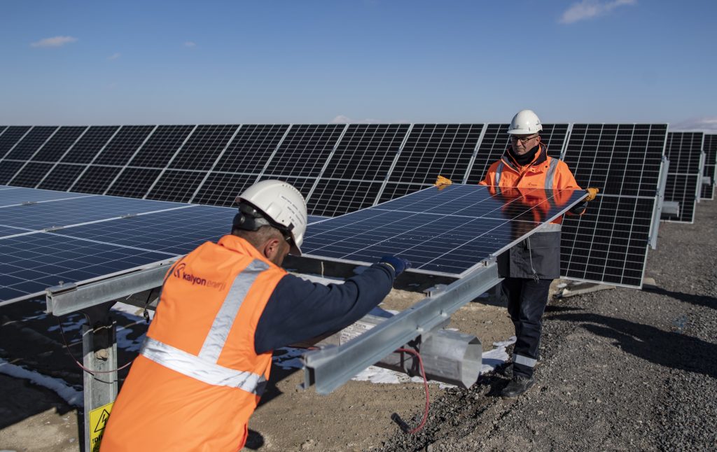 epa10501889 Technicians replace a photovoltaic panel after it was damaged by a stone bouncing from a passing car, at the Kalyon PV Karapinar Solar Power Plant in Konya, Turkey, 02 February 2023 (issued 04 March 2023). The SPP is the largest solar power plant in Europe and one of the largest in the world. It covers 20 million square meters, the equivalent to 2,600 football fields, and its construction began in 2020 in the Renewable Energy Resource Area (YEKA) of Karapinar. Once completed, its 3.5 million panels are expected to produce a combined output of 1,350 MW to meet the household energy demand of two million people.  EPA-EFE/ERDEM SAHIN