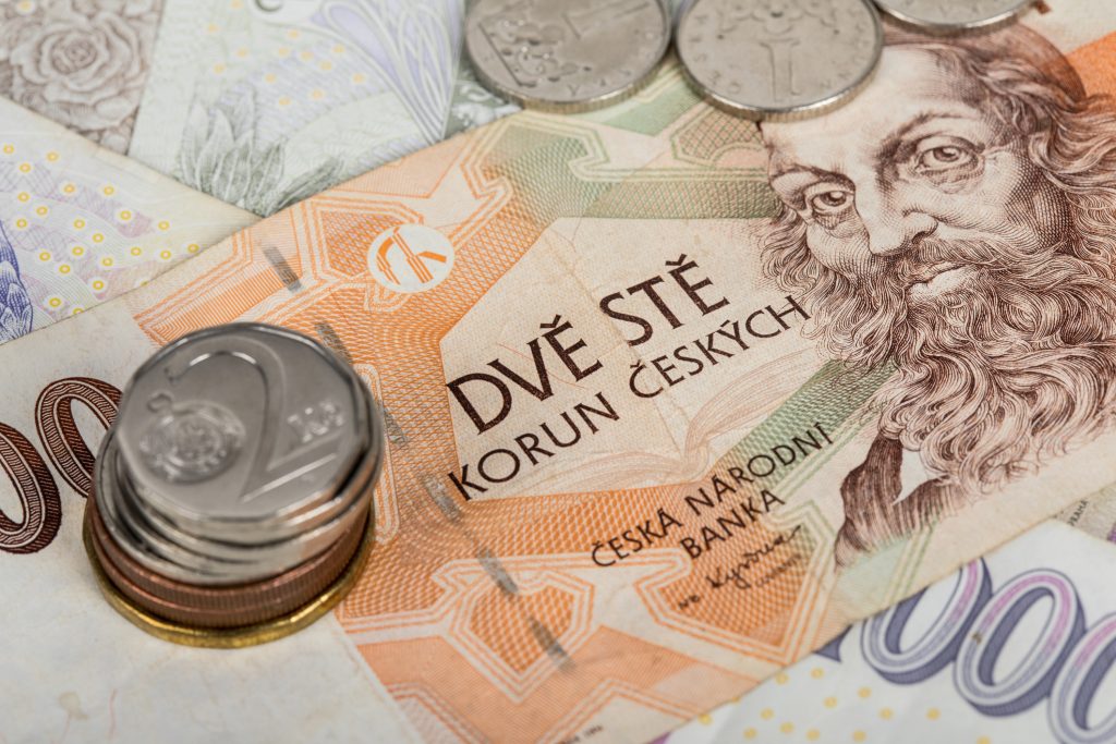 Czech banknotes and coins on the table.. business, finance, investment, saving and cash concept – close up of euro paper money and coins on table