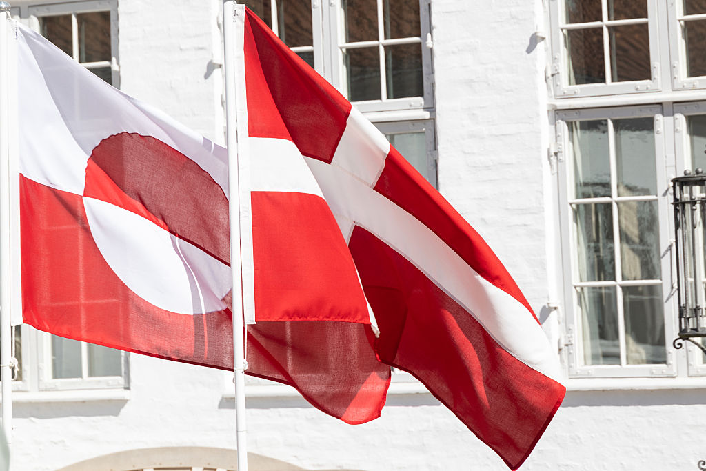 The Greenlandic and Danish flags fly during a joint doorstep