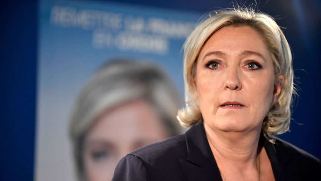 epa05918754 French presidential election candidate for the far-right Front National (FN) party, Marine Le Pen delivers a speech during a press conference at her campaign headquarters in Paris, France, 21 April 2017. A police officer the previous day was killed along with the attacker in a terror attack on the Champs Elysees. A total of three police officers were shot at on the city’s famous boulevard, with their suspected attacker killed by security forces.  EPA/JULIEN DE ROSA