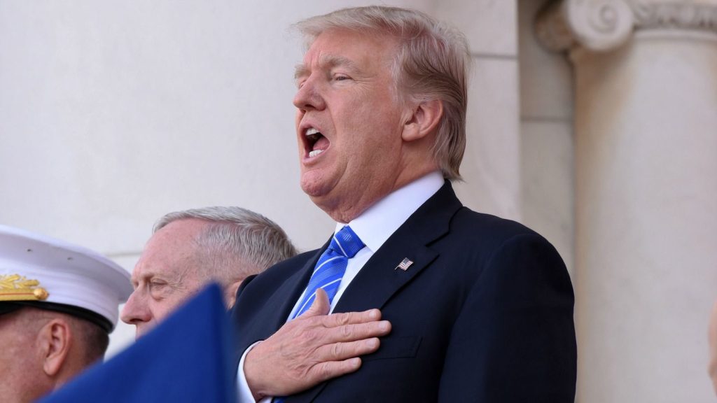 epa05997698 US President Donald J. Trump joins in singing the national anthem before making remarks at a wreath-laying ceremony at the Tomb of the Unknown Soldier at Arlington National Cemetery on Memorial Day, in Arlington, Virginia, USA, 29 May 2017. Memorial Day is observed on the last Monday of May and commemorates all men and women who have died in military service for the United States.  EPA/Olivier Douliery / POOL
