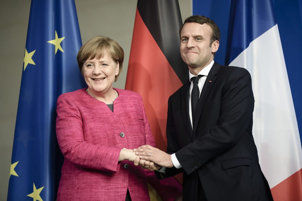 German Chancellor Angela Merkel welcomes French President Emmanuel Macron
