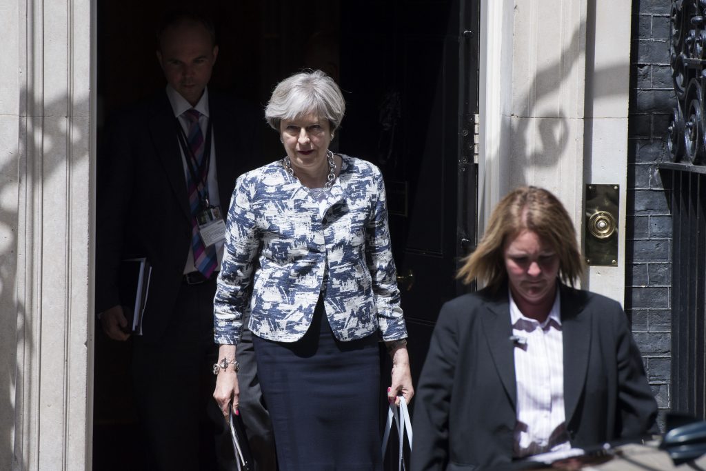 British Prime Minister Theresa May leave Downing Street after DUP deal