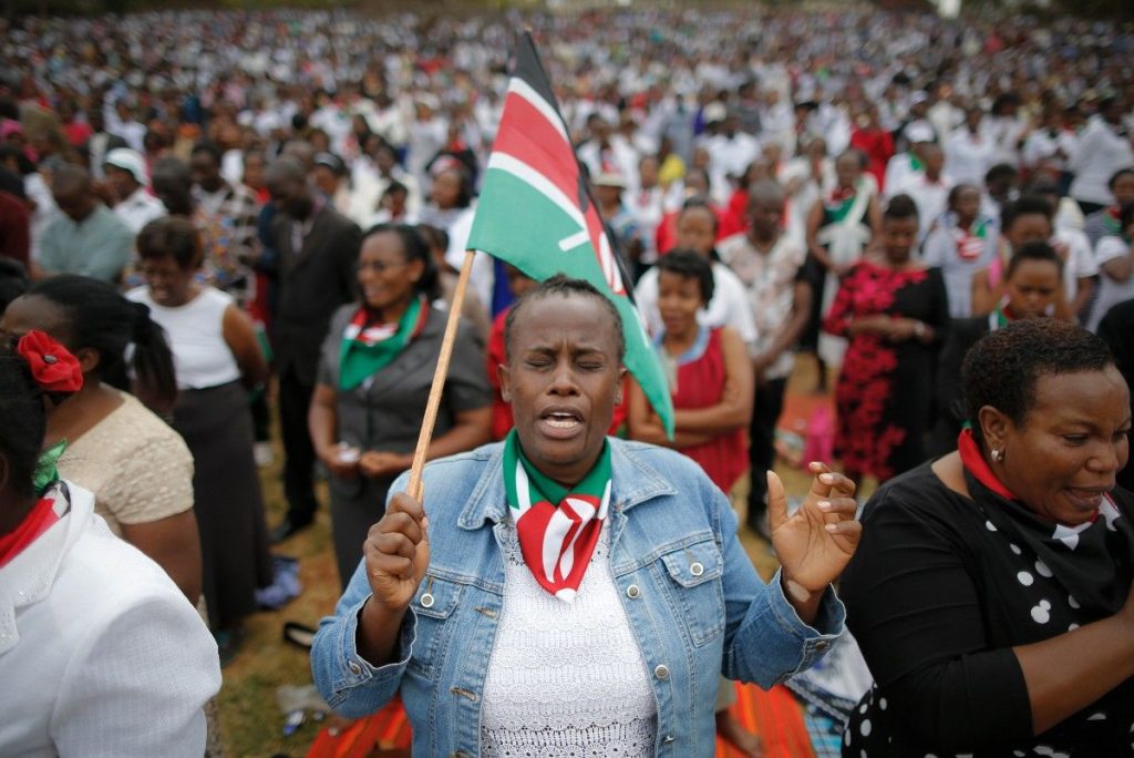 epa06117775 A woman becomes emotional as she joins others for prayers during a peace prayer rally attended by President Uhuru Kenyatta and his deputy William Ruto in Nairobi, Kenya, 30 July 2017. Thousands of Kenyans were led by religious leaders to gather and pray for peaceful elections in central Nairobi ahead of the 08 August poll in which President Kenyatta will be challenged by opposition leader Raila Odinga.  EPA/DAI KUROKAWA