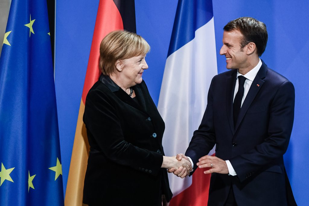 German Chancellor Angela Merkel welcomes French President Emmanuel Macron
