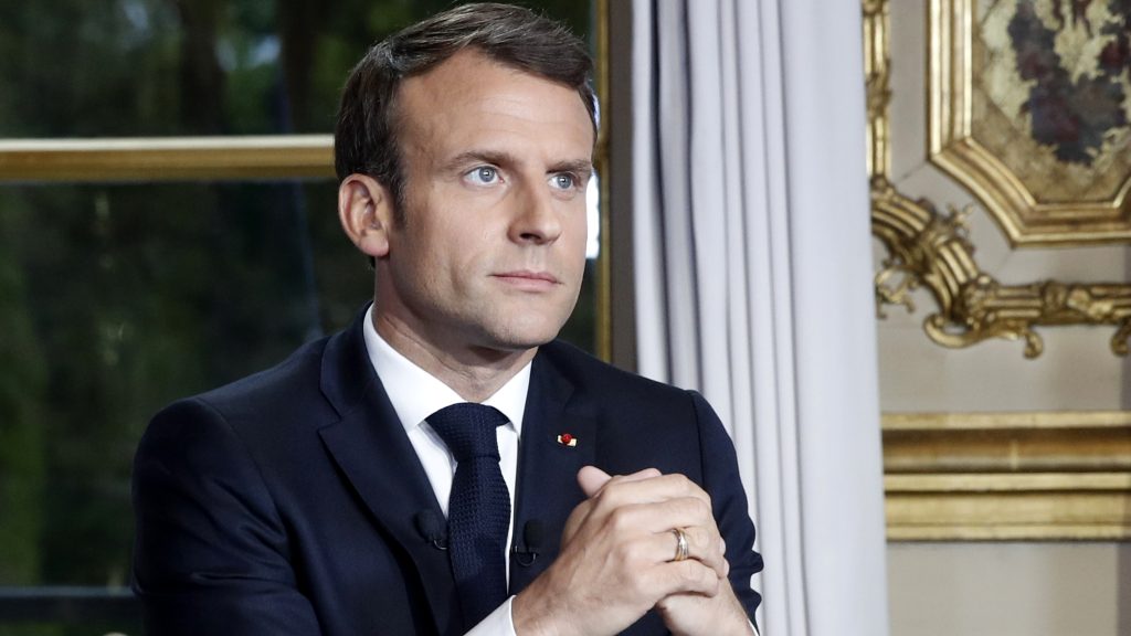 epa07510695 French President Emmanuel Macron gestures at his desk after addressing the French nation following a massive fire at Notre Dame Cathedral, at Elysee Palace in Paris, France, 16 April 2019. Macron canceled his announcement of a series of measures following the national Great Debate on 15 April because of the fire at Notre-Dame.  EPA-EFE/YOAN VALAT / POOL