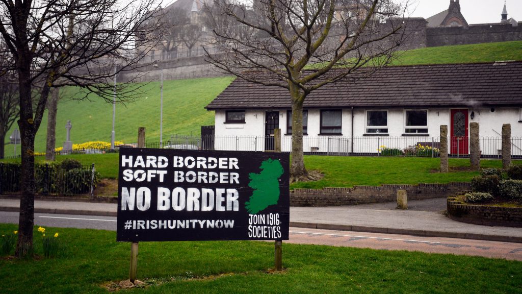 epa07447782 (21/28) An Anti-Brexit sign is displayed in the Republican area of the Bogside, a neighborhood outside the city walls, in Londonderry in Northern Ireland, Britain, 28 February 2019. In 1969 a battle against the RUC and local Protestants known as the ‚Battle of the Bogside‘ became a starting point of the Troubles.  On maps of Ireland, a line cuts across the north of the island like a scar, dividing Northern Ireland from the larger Republic of Ireland. That line is both physical and symbolic, signaling the geographic separation of two countries as well as their historical, social and religious differences. The reality of the Irish border is complex. Today, it is no longer a ?hard? border, though crossings are littered with rusting customs posts from another time. Often a change in road markings or the color of the tarmac are the only indicators that you have crossed into another country. It is possible to drive along a road and cross the border two or three times without even knowing it.The border, which stretches 499 kilometers (310 miles), was established in 1921 by the Anglo-Irish Treaty whereby 26 Catholic counties were granted autonomous status as the Republic of Ireland and six northern counties, inhabited mostly by Protestants loyal to the British monarchy, remained within the UK as Northern Ireland. The division of the island and the discrimination of the Catholic population in Northern Ireland led to a conflict between republican militias, mostly Catholics calling for union with the rest of the island, and unionist paramilitaries from largely Protestant areas who wanted to remain part of the UK. Decades of political violence, known as The Troubles, which began in the late 1960s and continued until the signing of the Good Friday Agreement in 1998, cost the lives of more than 3,000 people. After the signing of the international peace deal, bloodshed fell considerably, bringing an end to the need for fences and border barriers, and Irish citizen