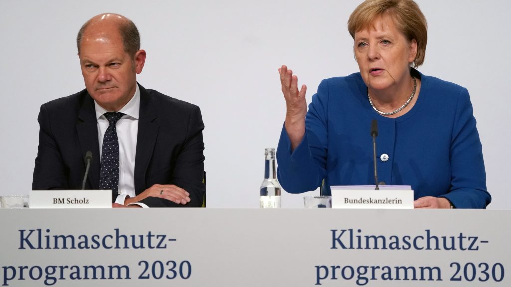 epa07856130 German Minister of Finance Olaf Scholz (L) and German Chancellor Angela Merkel attend a press conference after the meeting of the climate cabinet in Berlin, Germany, 20 September 2019. German government decided on measures to reduce carbon dioxide emissions in Germany.  EPA-EFE/ALEXANDER BECHER