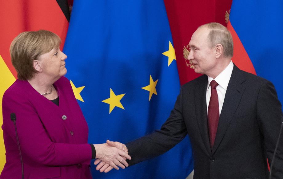 Russian President Vladimir Putin meets with German Chancellor Angela Merkel