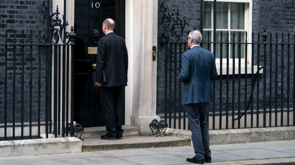 epa08348656 Chief Medical Officer for England Chris Whitty and Chief Scientific Adviser Sir Patrick Vallance keep safe distance as they arrive for the press briefing at 10 Downing Street, Central London, Britain, 07 April 2020. According to reports on 06 April 2020, British Prime Minister Boris Johnson was admitted to intensive care in hospital eleven days after being tested positive for coronavirus Covid-19.  EPA-EFE/WILL OLIVER