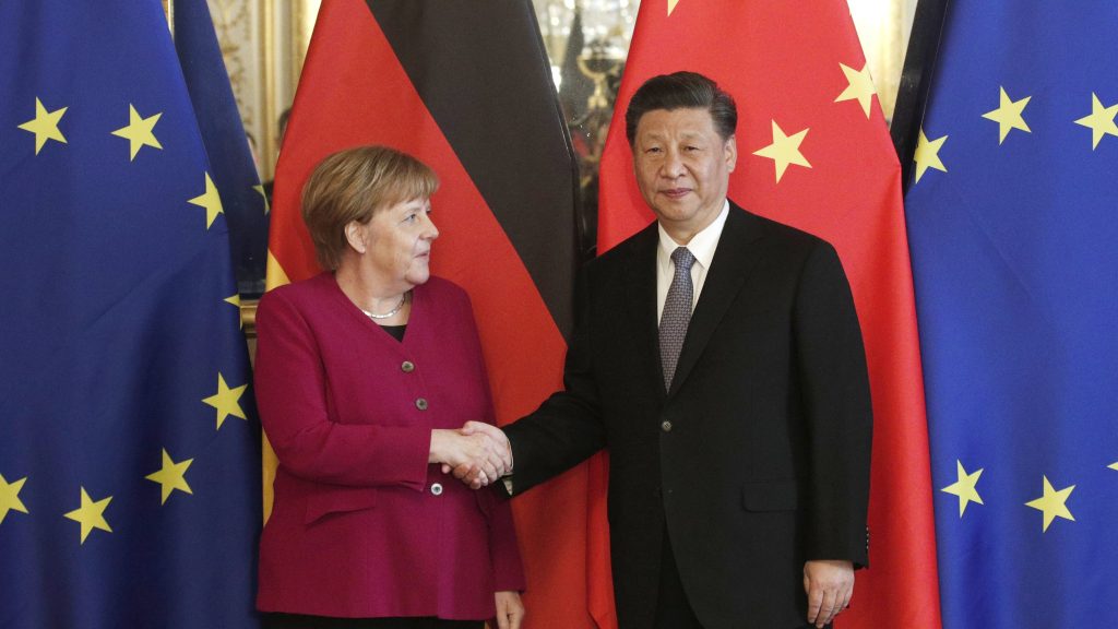 epa07464476 Chinese President Xi Jinping (R) and German Chancellor Angela Merkel (L) shake hands as they pose for photographs ahead of a bilateral meeting at the Hotel de Marigny residence in Paris, France, 26 March 2019. Chinese President Xi Jinping is on a three-day state visit to France on the final leg of his European tour.  EPA-EFE/YOAN VALAT